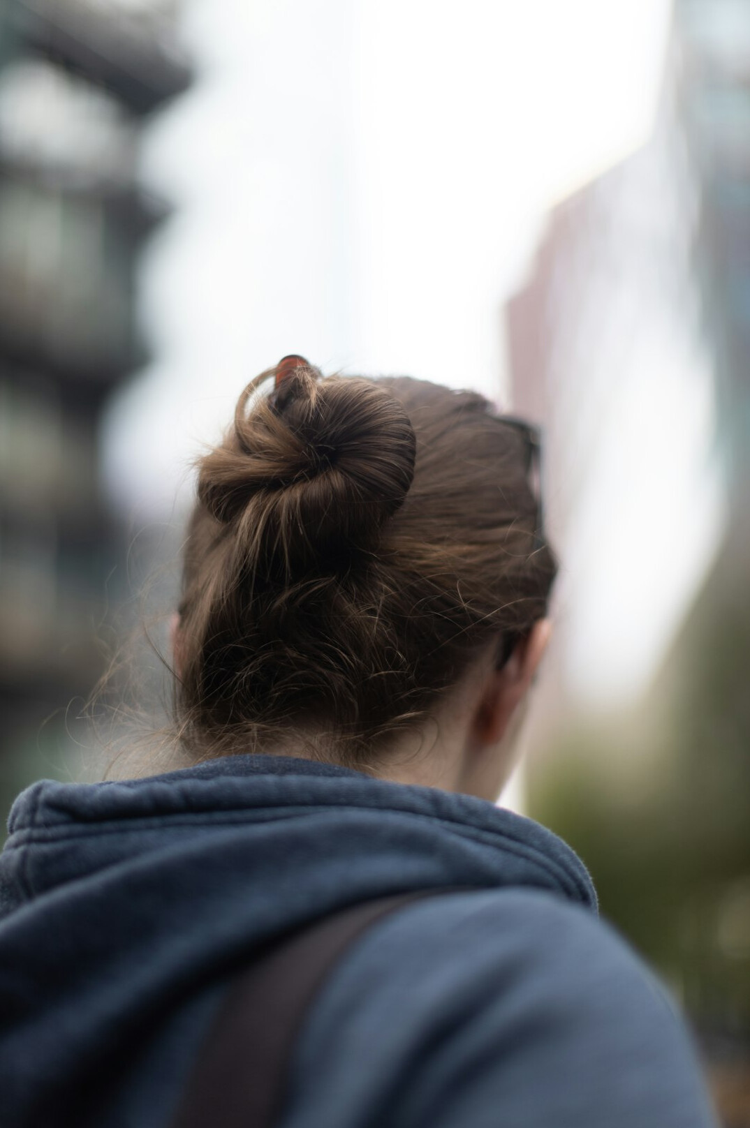 Woman with a hair tied back, acoustic consultant portrait